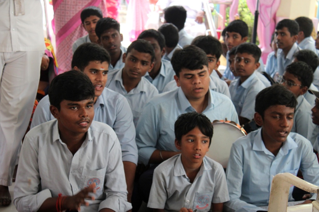 Students offering Bhajans at the old age home Sri Sai Mandir